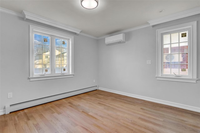 spare room featuring a wall mounted air conditioner, light hardwood / wood-style floors, crown molding, and baseboard heating