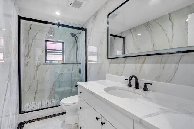 bathroom with vanity, toilet, and walk in shower