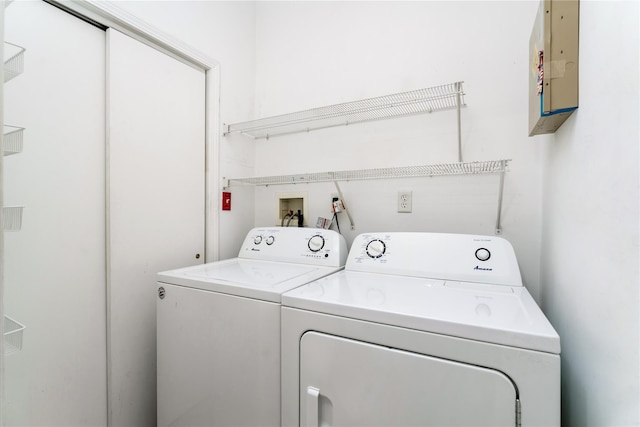 laundry room featuring separate washer and dryer