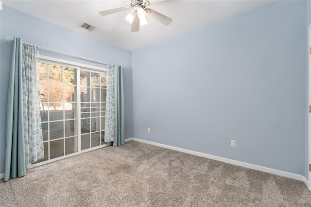 carpeted empty room featuring ceiling fan