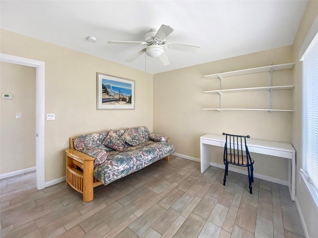 living area with ceiling fan