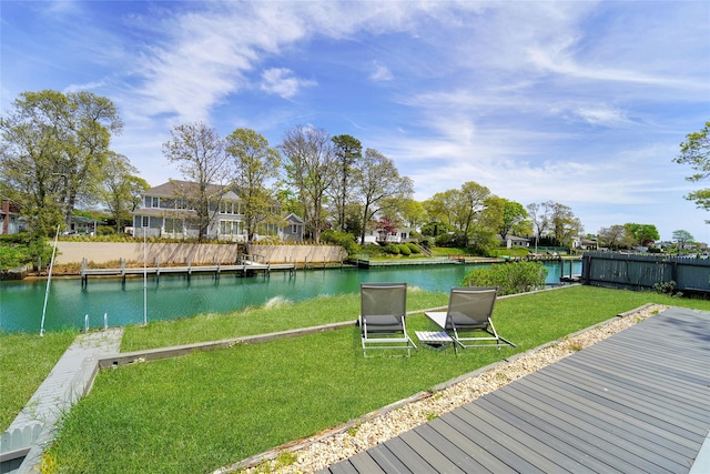 exterior space featuring a water view and a lawn