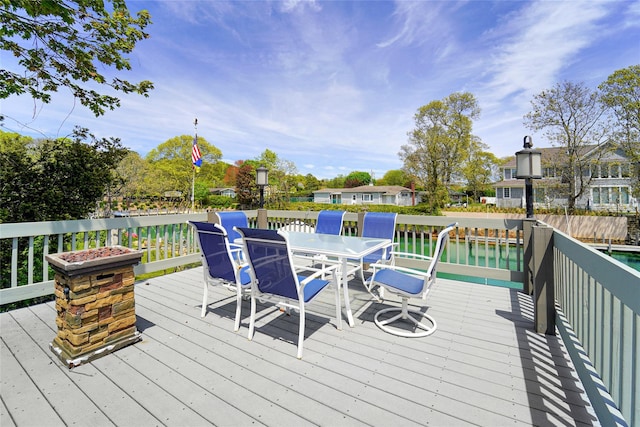 wooden deck with a water view