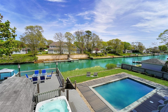 view of swimming pool featuring a deck with water view