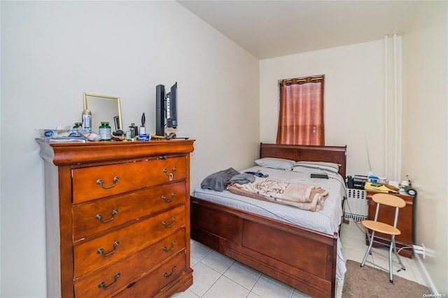 bedroom featuring light tile patterned floors