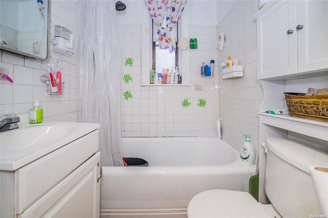 full bathroom with tasteful backsplash, shower / bath combination with curtain, toilet, vanity, and tile walls