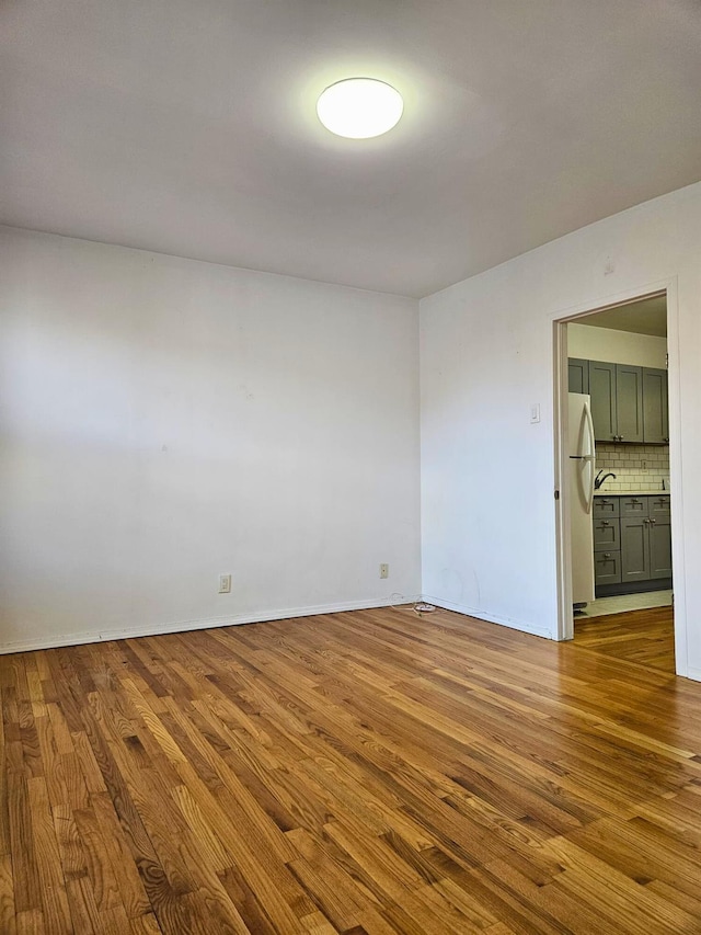 spare room with light wood-type flooring