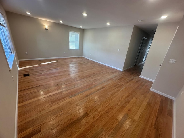 unfurnished room with light hardwood / wood-style floors