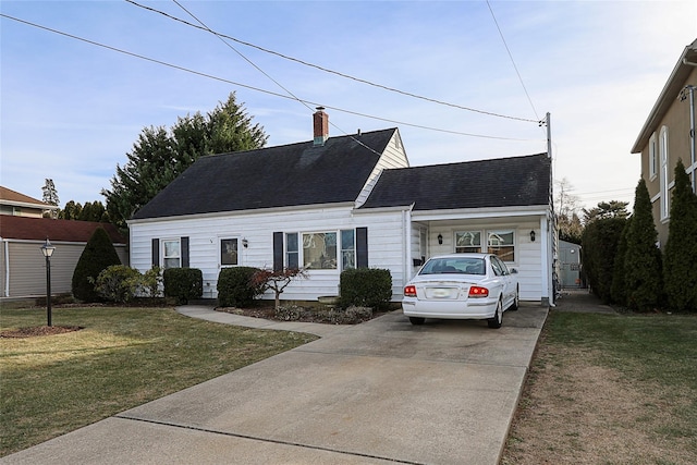 cape cod home with a front yard