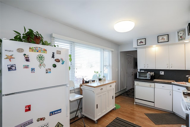 kitchen with white appliances, a baseboard heating unit, white cabinets, light hardwood / wood-style flooring, and tasteful backsplash