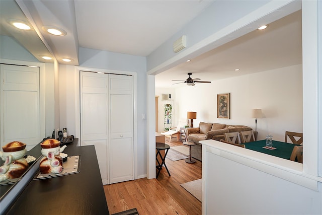 kitchen with ceiling fan and light wood-type flooring