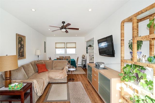 living room with ceiling fan and hardwood / wood-style flooring