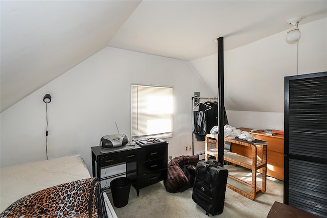 carpeted office space featuring vaulted ceiling