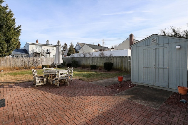 view of patio featuring a storage shed