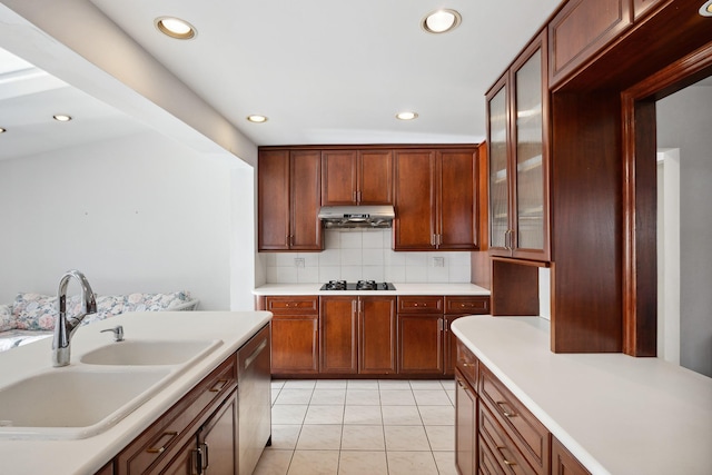 kitchen with backsplash, black gas cooktop, sink, stainless steel dishwasher, and light tile patterned floors