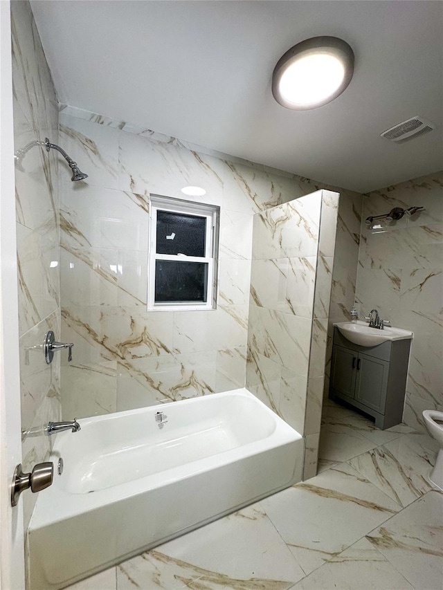 full bathroom featuring bathing tub / shower combination, vanity, and toilet