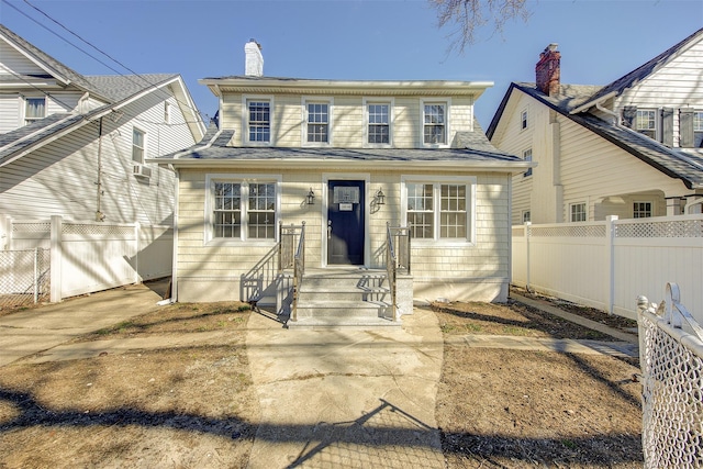 view of front of house featuring fence