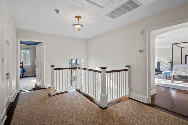 corridor featuring dark hardwood / wood-style floors