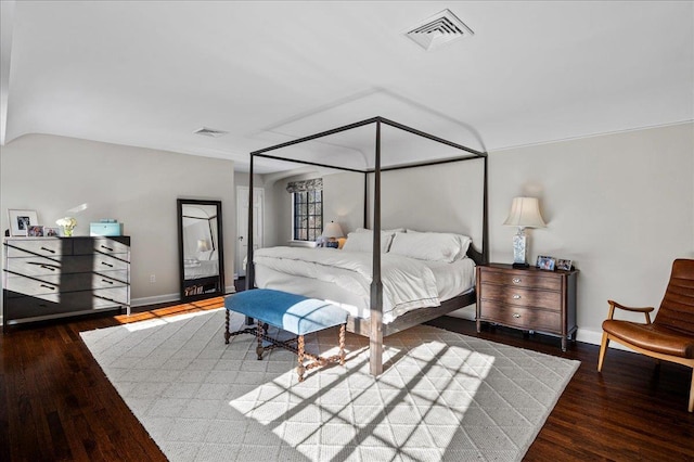 bedroom featuring dark hardwood / wood-style flooring