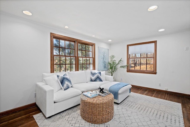 living area with recessed lighting, baseboards, and wood finished floors