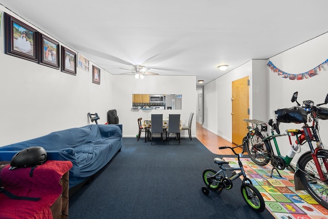 living room featuring ceiling fan