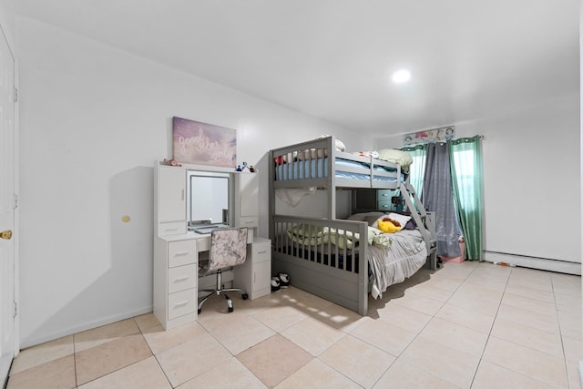 bedroom with light tile patterned floors and a baseboard radiator