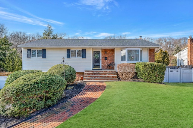 ranch-style home with a front yard