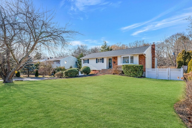 single story home featuring a front yard