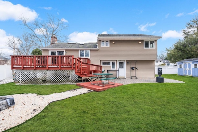 back of property featuring a lawn and a deck