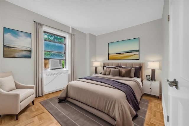 bedroom featuring light parquet floors and cooling unit