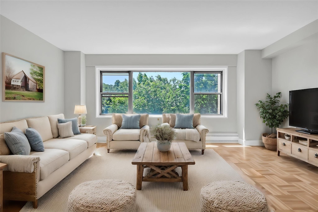 living room featuring a wealth of natural light and light parquet floors