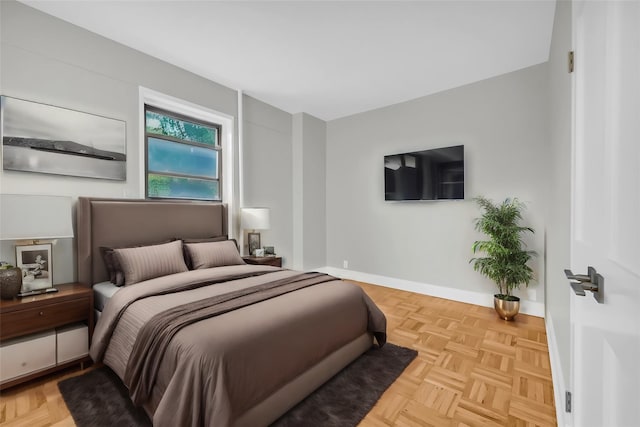 bedroom featuring light parquet floors