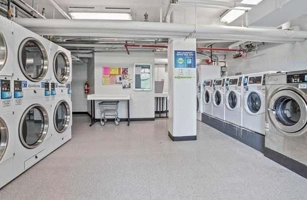 9 Fordham Hill Oval Unit 3C, Bronx, NY 10468 - community laundry room with stacked washer / drying machine and washing machine and dryer