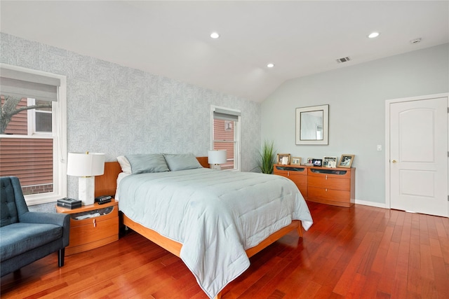 bedroom with hardwood / wood-style floors and vaulted ceiling