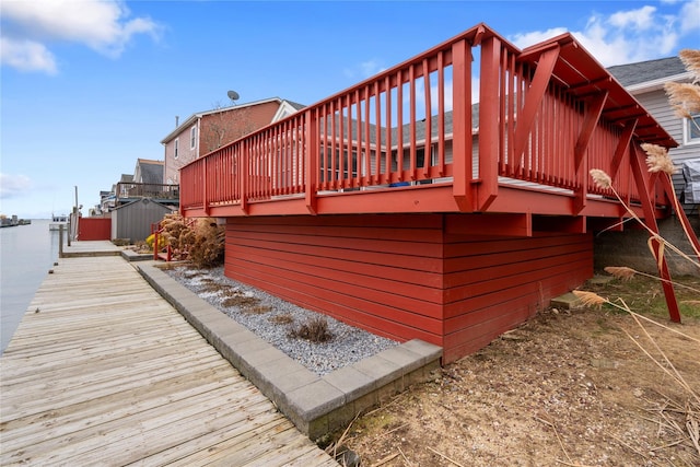 wooden terrace with a boat dock