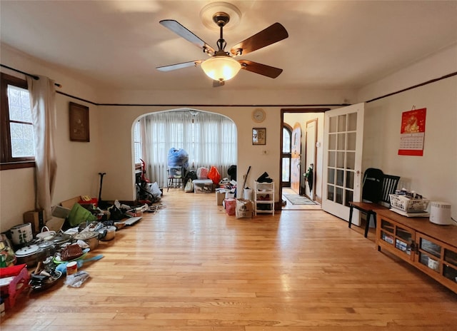 interior space with french doors, ceiling fan, and light hardwood / wood-style flooring