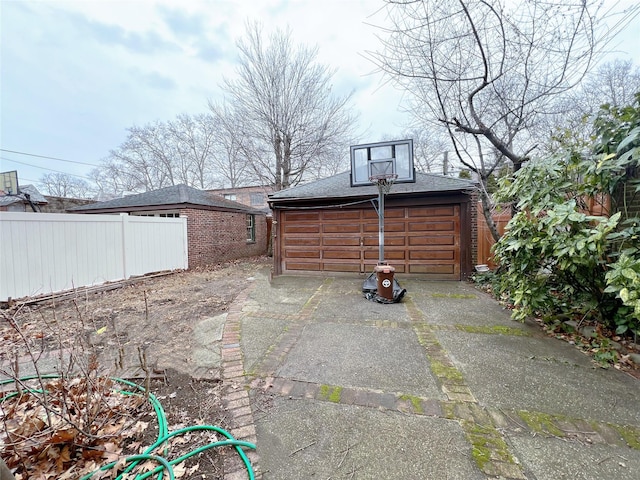 view of patio with a garage and an outdoor structure