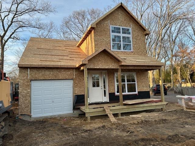 view of front facade with a garage and covered porch