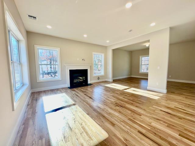 unfurnished living room featuring light hardwood / wood-style flooring