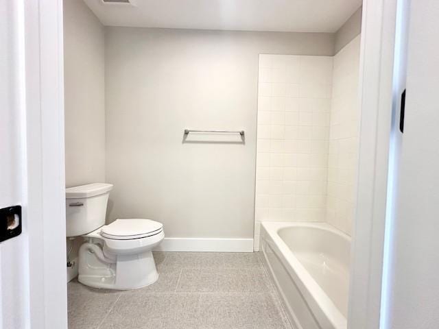 bathroom with tile patterned flooring and toilet