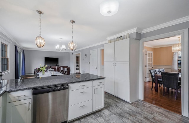 kitchen with dark stone counters, white cabinetry, stainless steel dishwasher, and light hardwood / wood-style floors