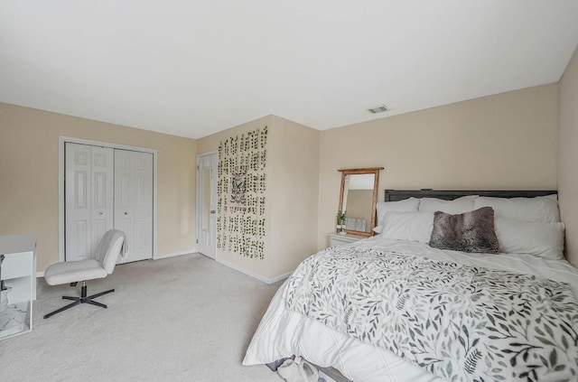 bedroom with light colored carpet and a closet