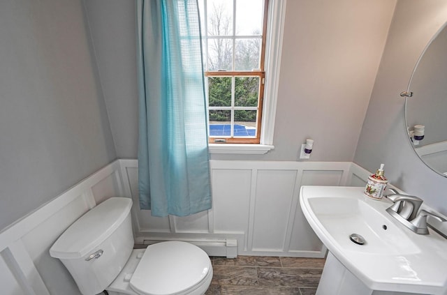 bathroom featuring sink and toilet