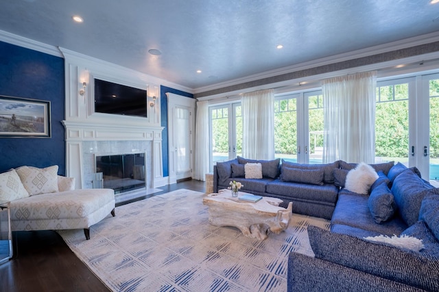 living room featuring french doors, crown molding, and wood-type flooring