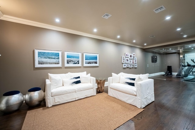 living room featuring dark hardwood / wood-style flooring and crown molding