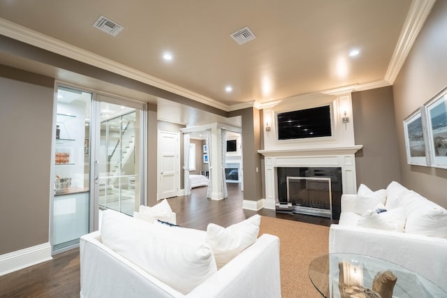 living room with dark hardwood / wood-style flooring and ornamental molding