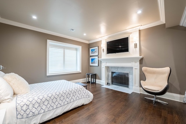 bedroom with dark hardwood / wood-style floors and crown molding