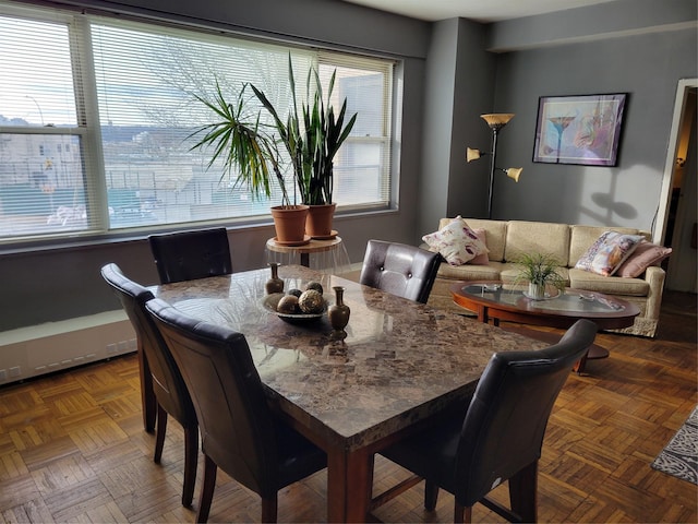 dining room with parquet flooring