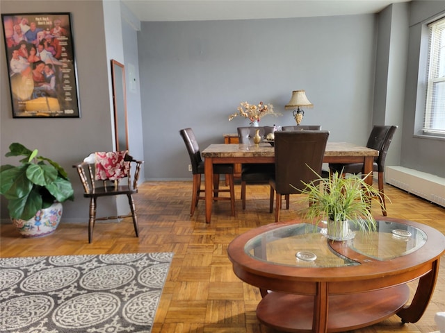 dining area with parquet floors