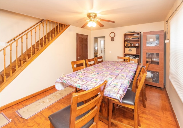 dining room featuring ceiling fan and hardwood / wood-style flooring